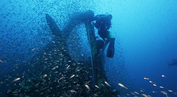 A diver inspects the Merak’s stern area